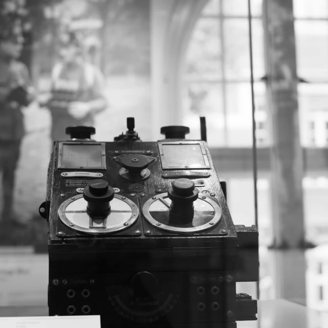 a portable radio sitting next to an empty vase