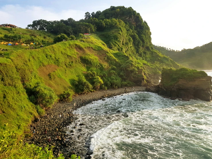 a scenic view of a cliff overlooks the water