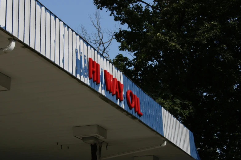 a red and blue sign with words for a hospital