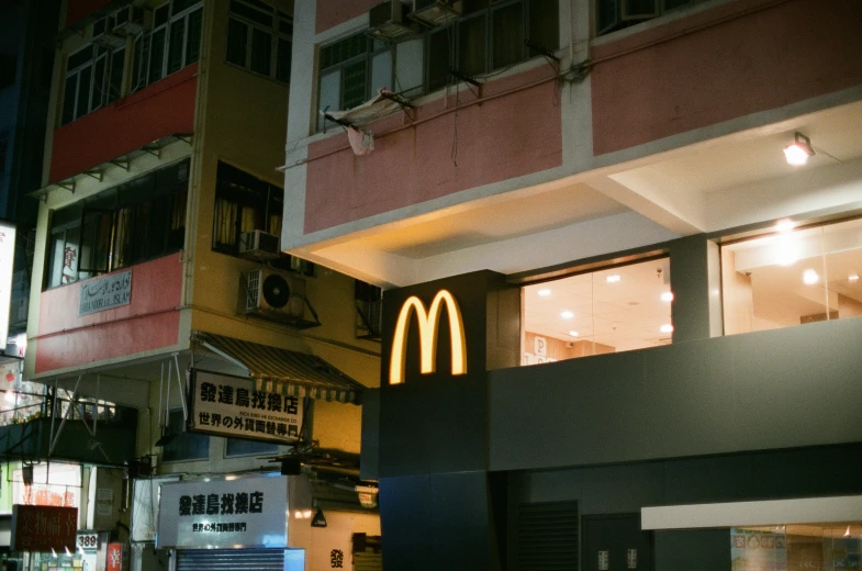 a building has lights hanging above the entrance