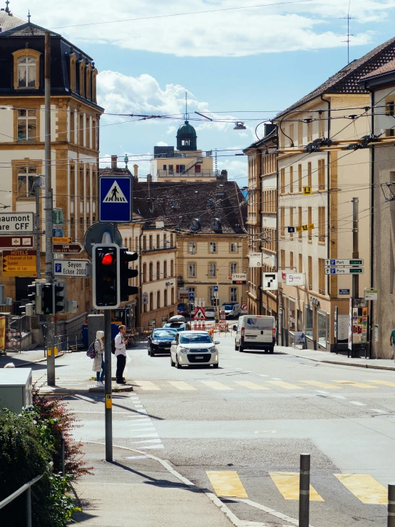 a street intersection with a red light in the middle