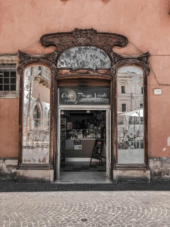 old building with large mirror windows and doors