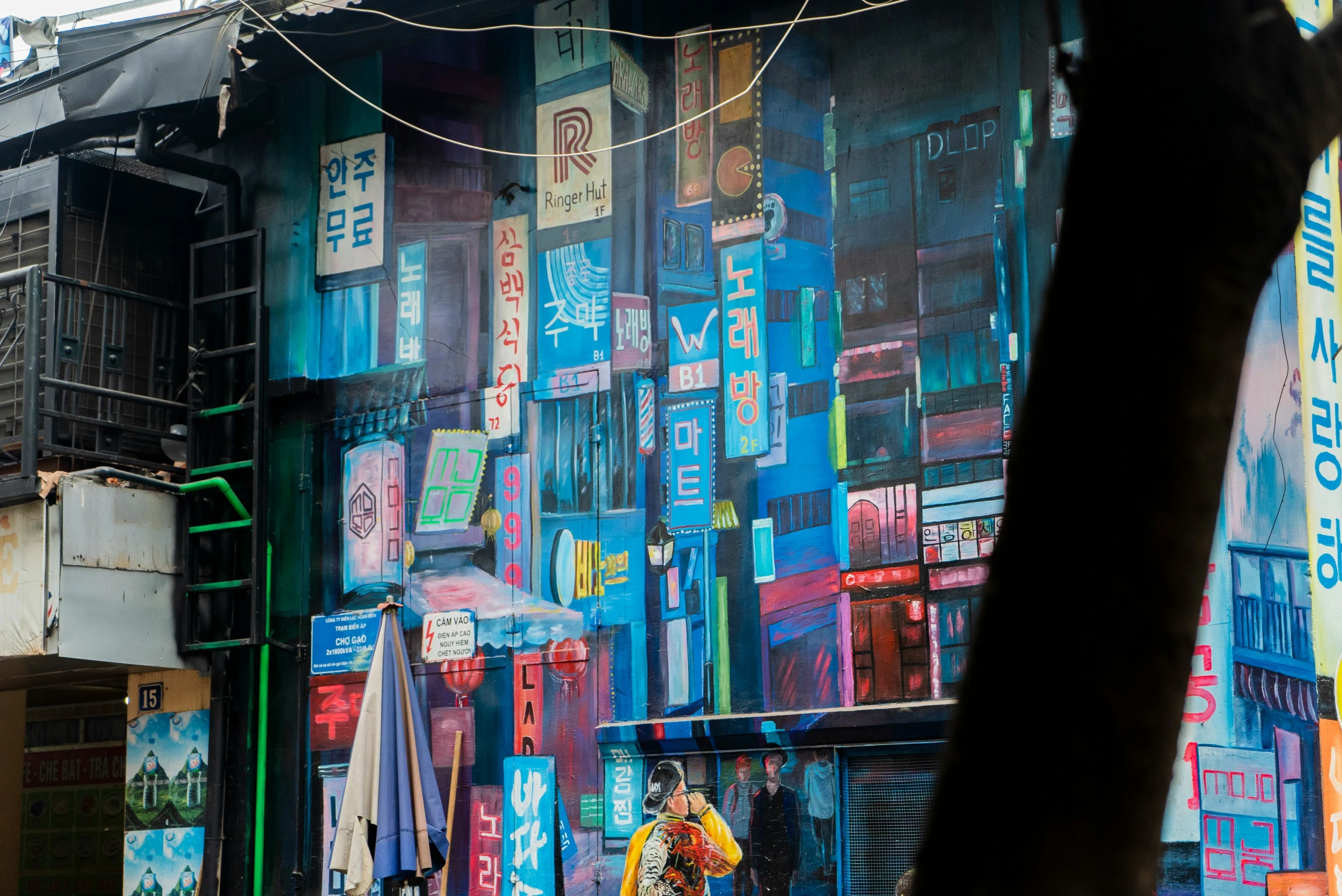 a person walking down a street under an umbrella