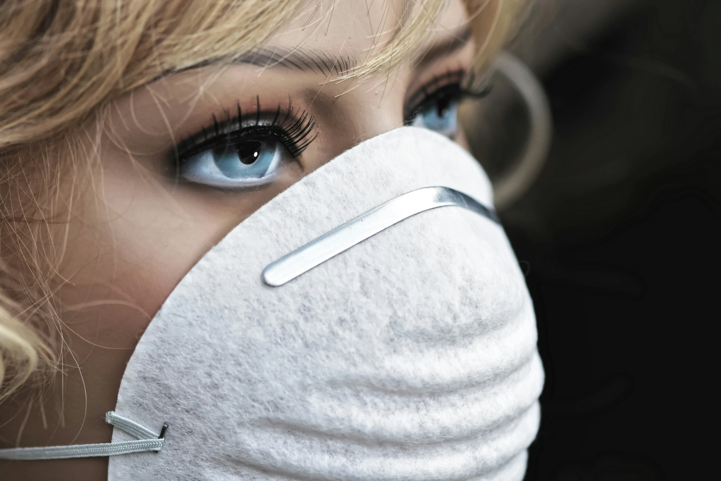 blue eyes are wearing a mask to prevent it from smogging
