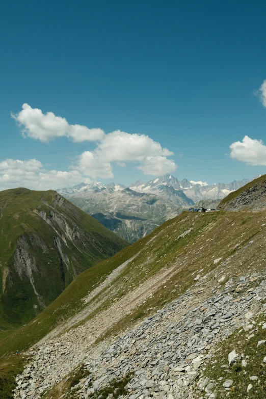 a man riding a snowboard down the side of a rocky slope