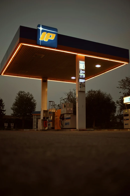 a service station that is lit up at night