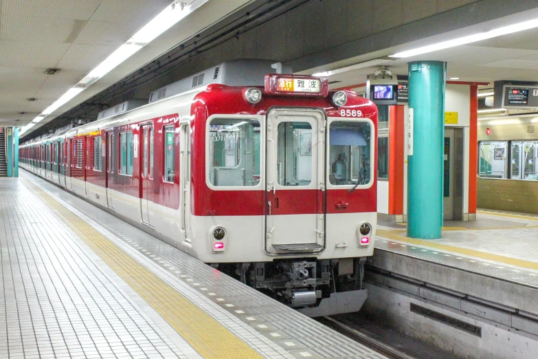 an underground subway train parked at the station