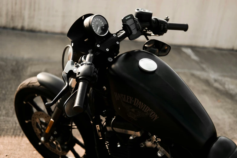 a black motorcycle parked in front of a building