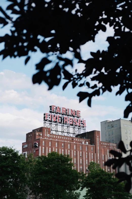 a sign on top of a brick building