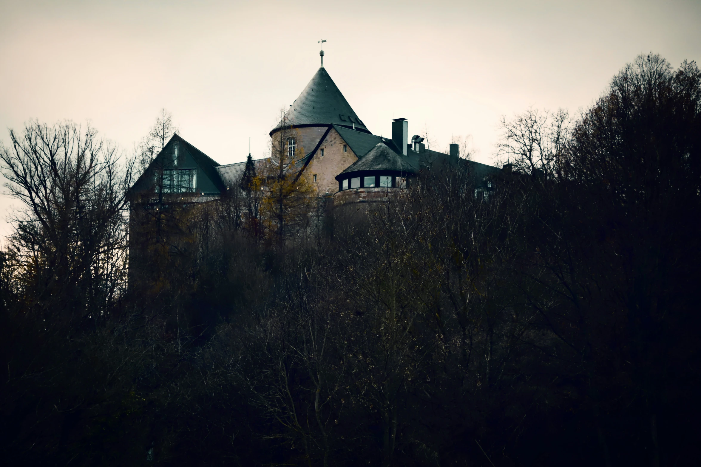 an old building that is surrounded by trees