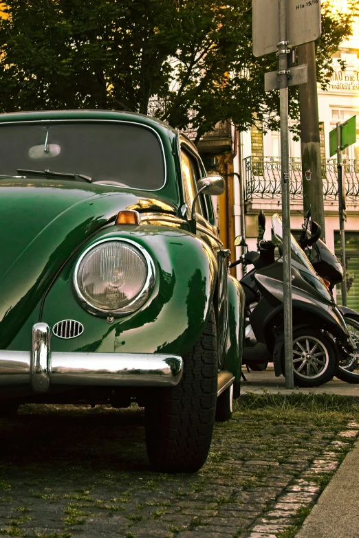 the car is parked beside of the motorcycle