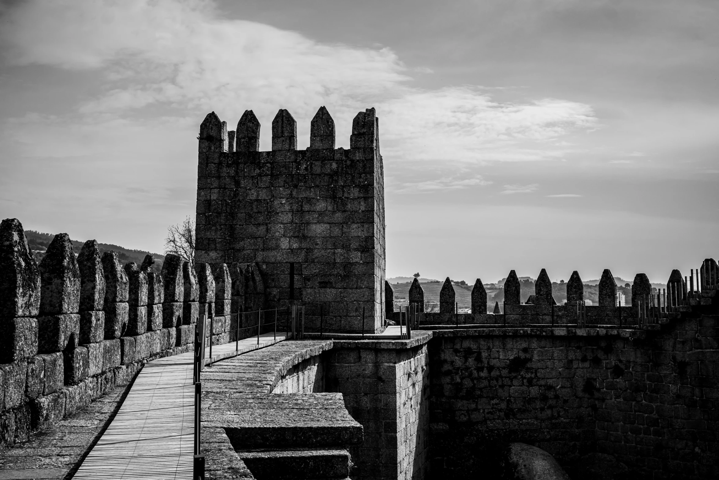 the view of old ruins in a dark castle type setting