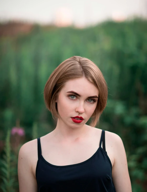 an up close po of a woman with red lipstick