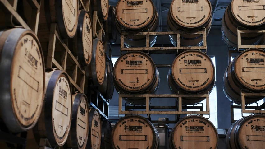 wooden barrel stacked in rows for sale in a store