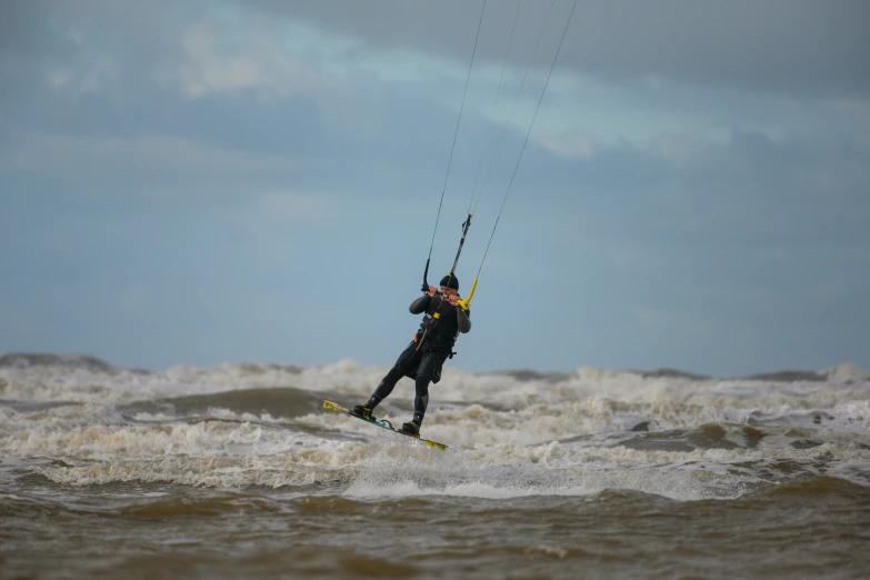 a person is kiteboarding in the water