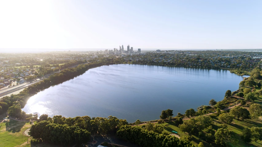 an image of a lake in the middle of a large city