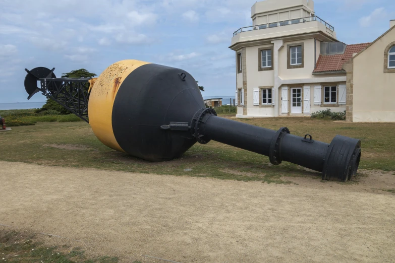 the artillery on the ground is placed on top of the grass