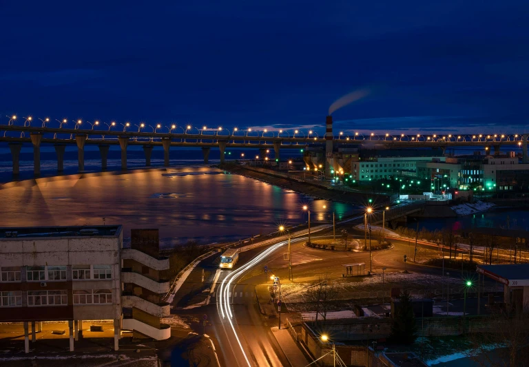 an image of a bridge over water at night