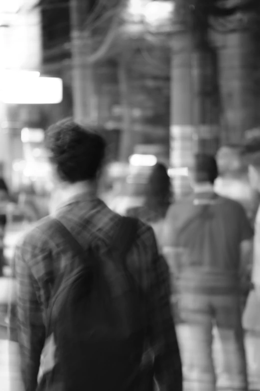 people standing in a lobby near a building