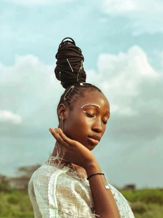 a black woman holding her hands up and looking away