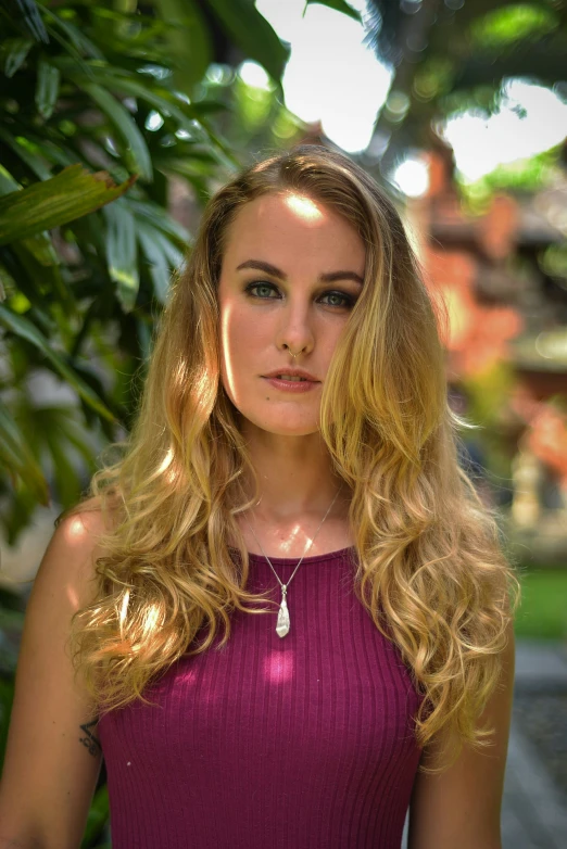 a woman posing with her hair in the wind