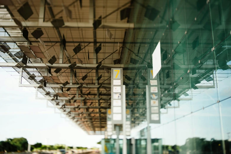 the ceiling of a train station with the lines going upward