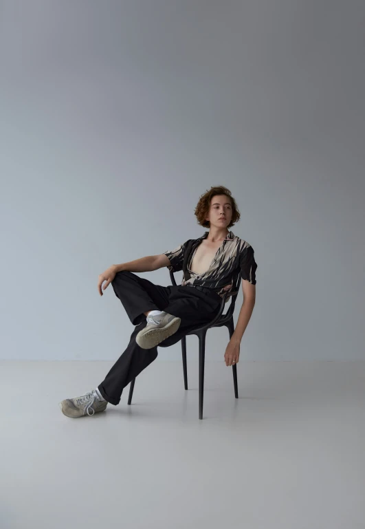 a person is posing on a chair for the po shoot