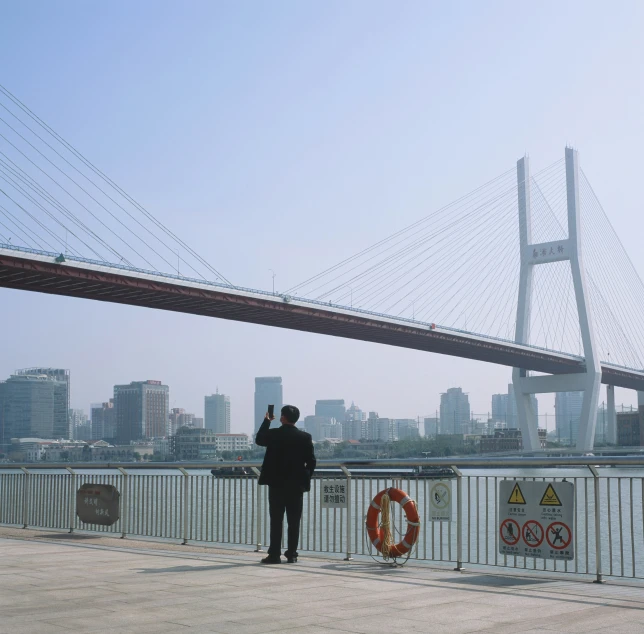 a man is taking a po from the water