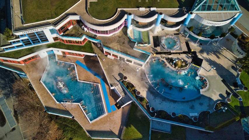 the aerial view of an outdoor pool and spa area