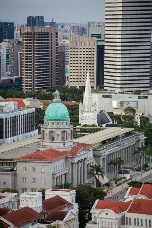 view of various buildings and trees and skyscrs