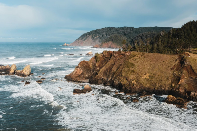 the ocean and rocky coast line near the shore