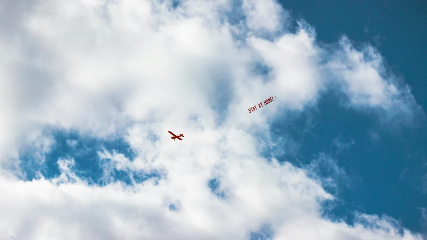 an airplane is flying through the clouds in the sky