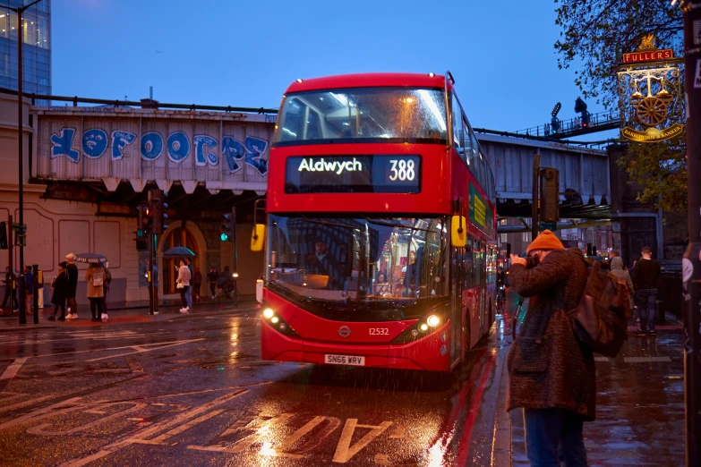 there is a double decker bus that is on the street