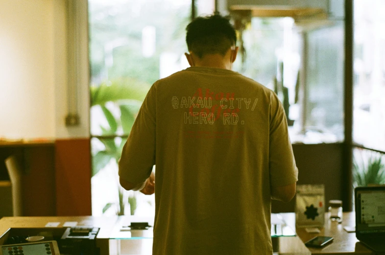 a person standing in an office looking into the room