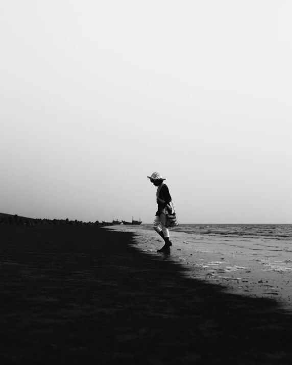 man standing at the end of a large body of water