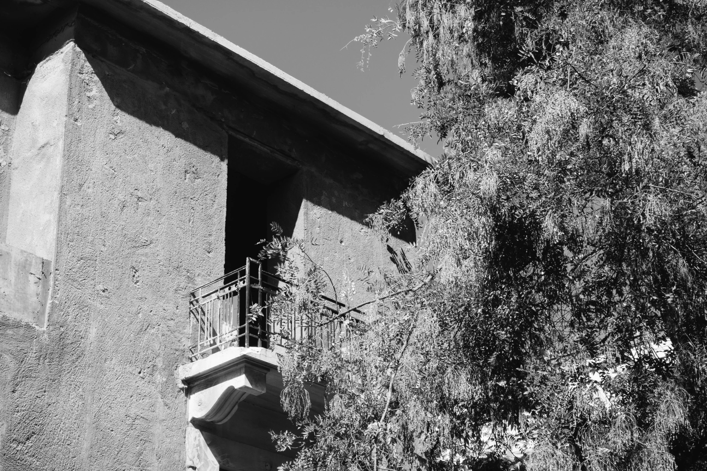 a stone building with balconies on top