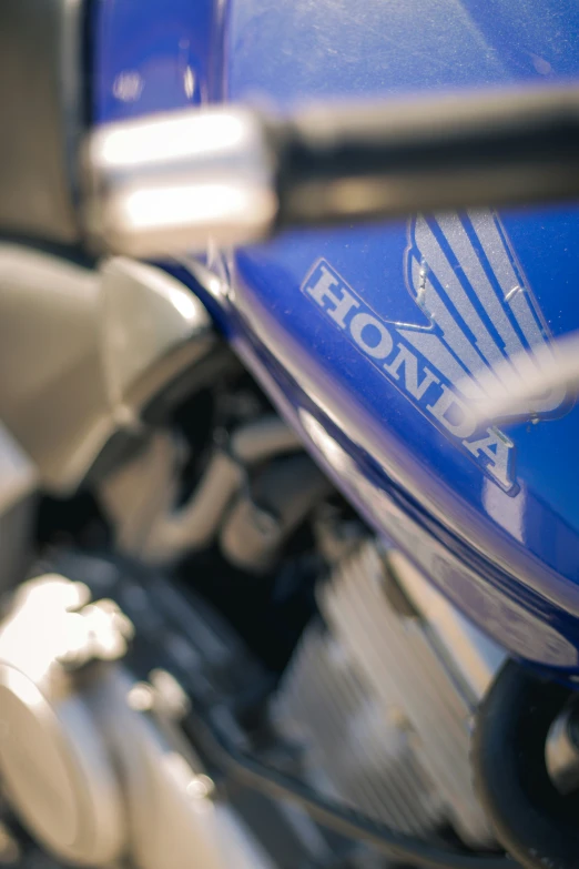 closeup of the front of a motorbike with logos on it