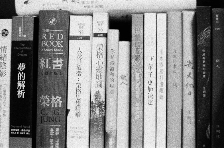 several stacks of books with asian writing on them