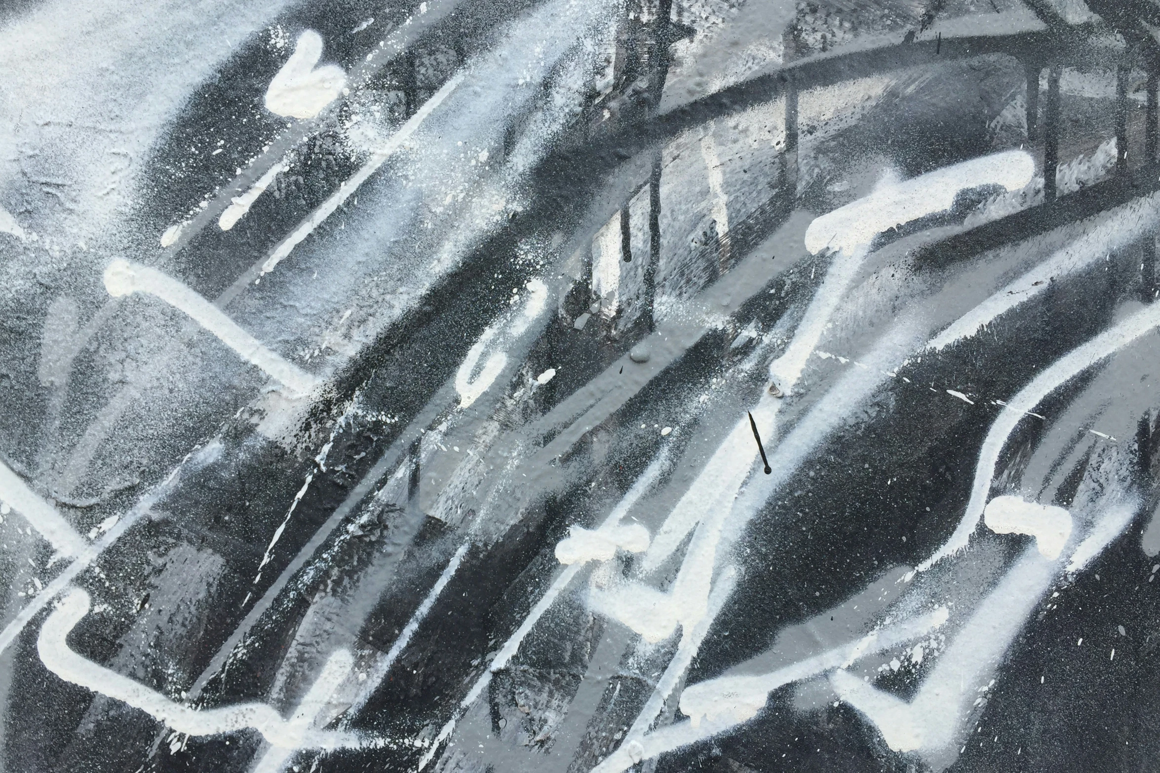 an abstract painting with different black and white colors