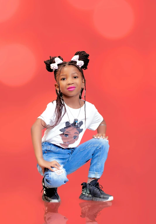 a  poses for a portrait with her hair in pigtails