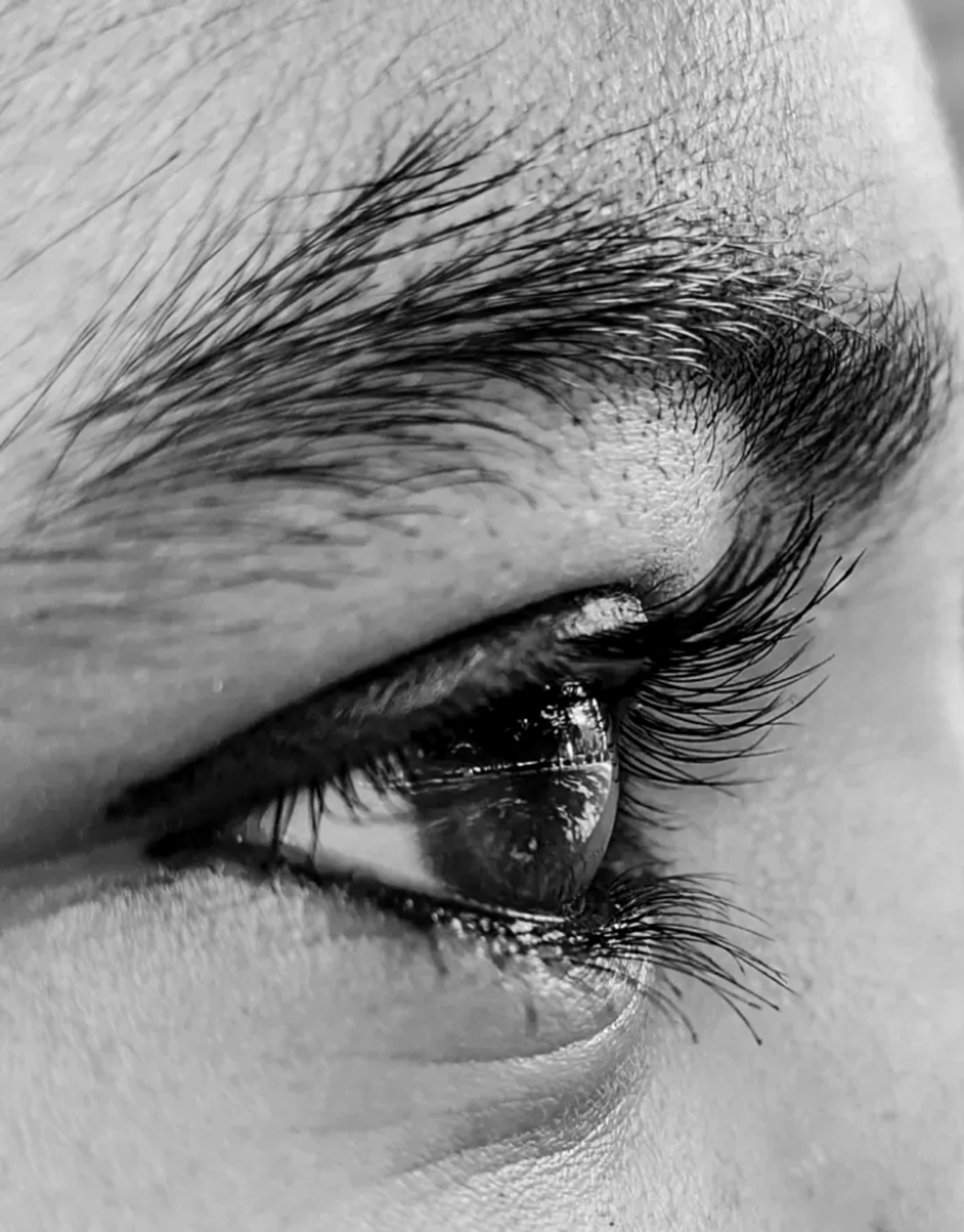 black and white image of a woman's eye