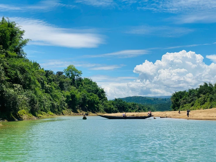 a person in a boat traveling down a river