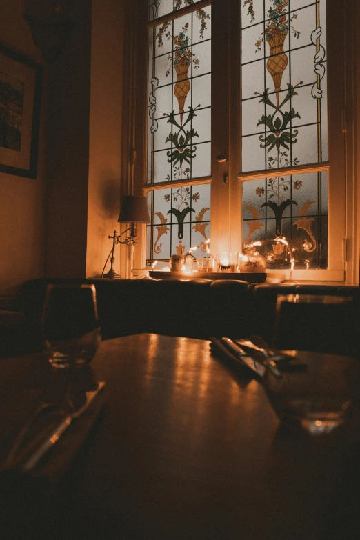 a dimly lit room with a wooden table