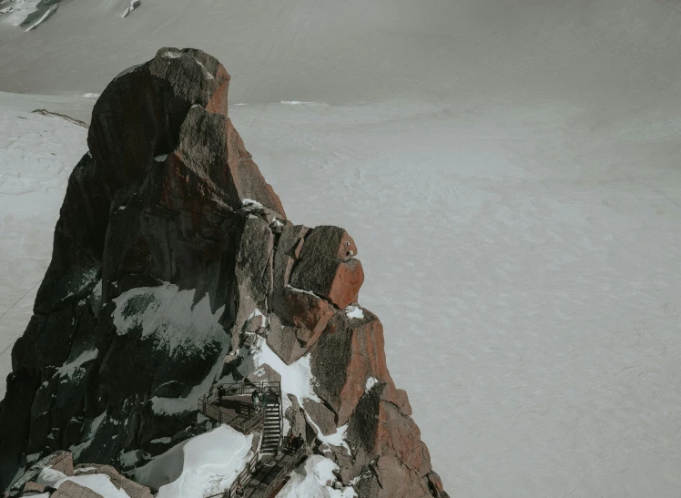 a snowy mountain with a person standing on it