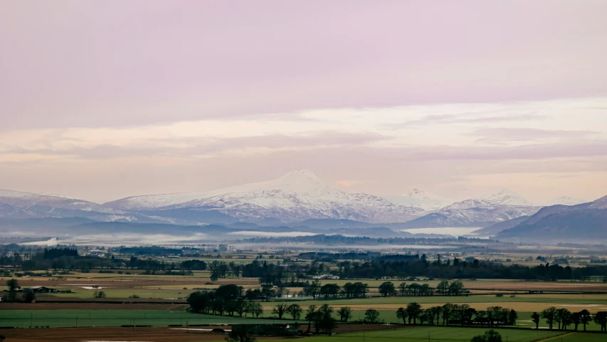 an expansive landscape with mountains in the background