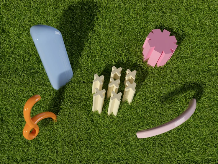 several objects sit on grass, each different and in different colors