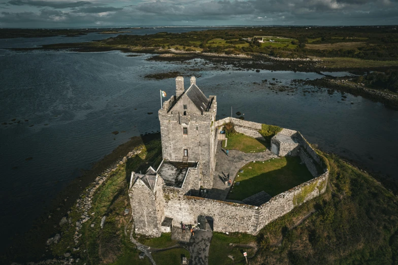 the castle is situated on an island near a body of water