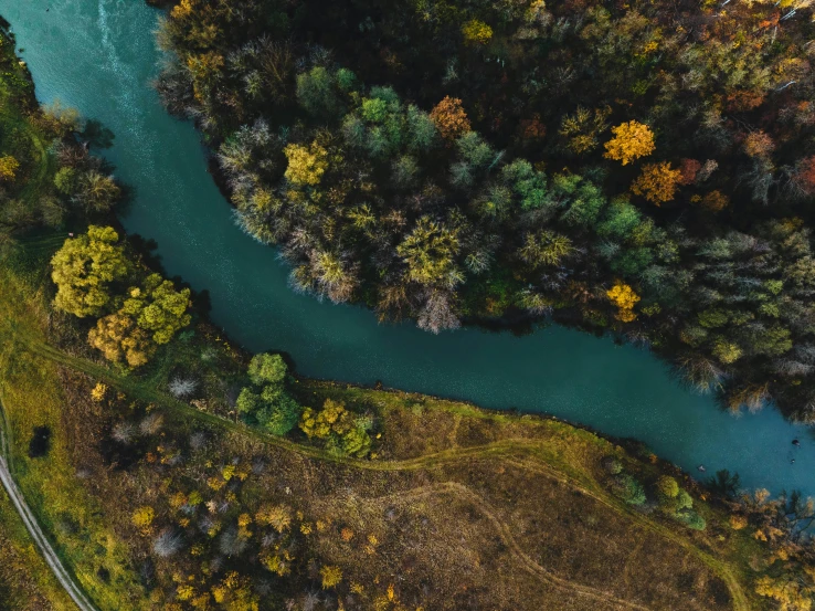 an aerial po shows the green water of a river