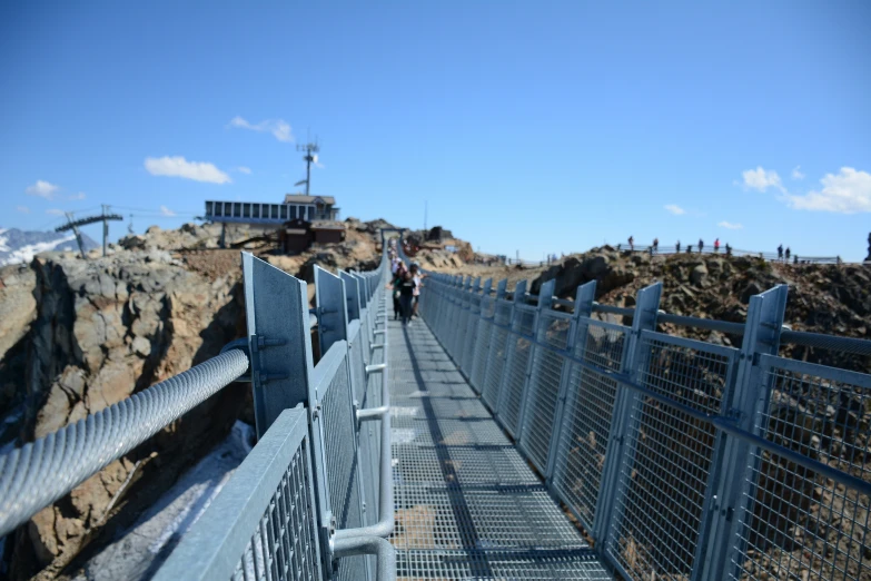 the people walk on the bridge over the water