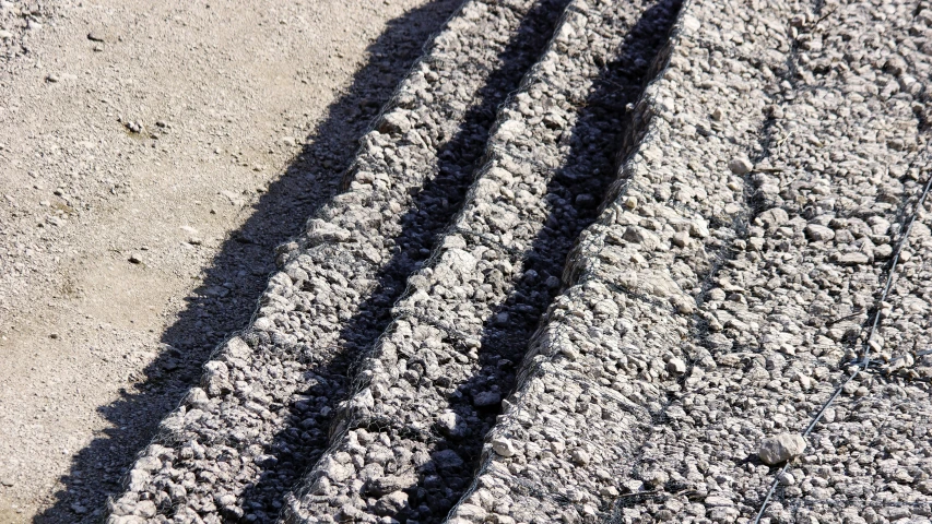 shadow of a person and a fire hydrant on pavement